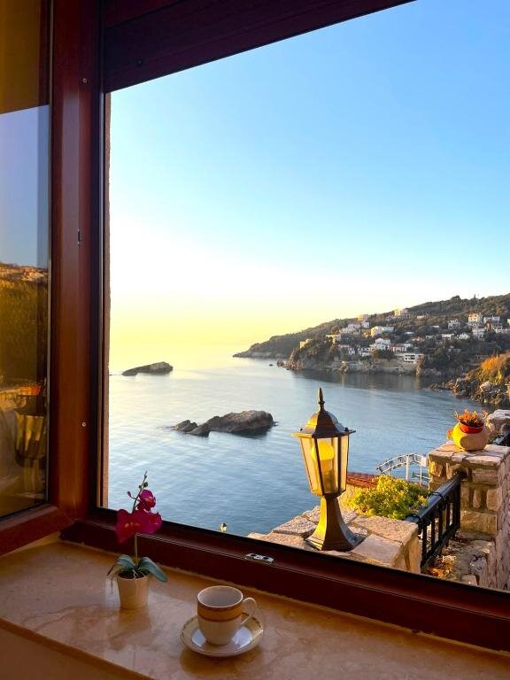View of the Adriatic sea through an apartment window in Ulcinj Old Town